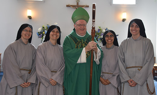 Bishop Dennis Sullivan stands with Sister Joseph; Sister Agnes, Local Servant; Sister Chiara; and Sister  Ann Kateri. In left photo, Franciscan Sisters of the Renewal at the Wedding of the Sea celebration in Atlantic City on Aug. 15.

Photo above by James A. McBride, below by Mike Walsh