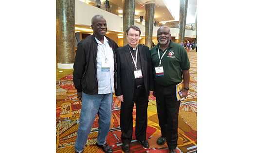 James Andrews (far right), director of Black Catholic Ministries for the Diocese of Camden, with Judge John Chatman of the Diocese of El Paso, Texas, and Archbishop Christophe Pierre, apostolic nuncio to the United States, at the National Black Catholic Congress in Orlando last month.