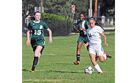 Racquel Ramey of Bishop Eustace, Pennsauken, pushes the ball past Camden Catholic, Cherry Hill, defenders on Sept. 5, during her team’s 6-5 win in Pennsauken.

Photo by Alan M. Dumoff