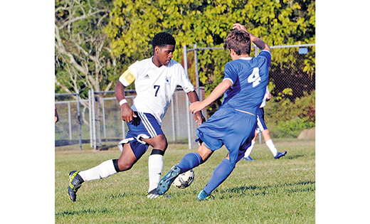 Last week in Absecon, visiting Wildwood Catholic shut out the home squad, Holy Spirit, by a score of 5-0 in boys’ high school soccer. Above, Wildwood Catholic’s Jordan Holmes (4) maneuvers past De-Quawn Johnson (7) during the Sept. 29 contest.

Photo by Alan M. Dumoff