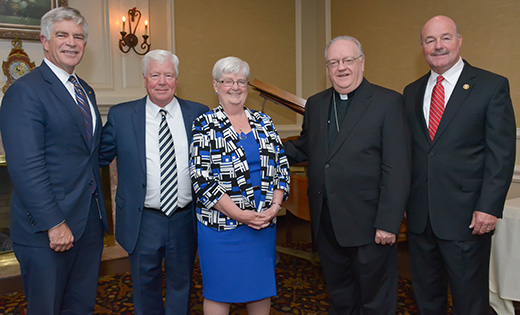Gloucester Catholic High School paid tribute to long-time Principal and former Head of School John Colman on Thursday night, Nov. 2, with a retirement party at Tavistock Country Club in Haddonfield. Among those honoring Colman (2nd from left) on his more than 40 years of service to the Gloucester City school and the Diocese of Camden were Patrick Harker, ’77, President and Chief Executive Officer of the Federal Reserve Bank of Philadelphia; Mary Boyle, Superintendent of Catholic Schools for the Diocese of Camden; Bishop Dennis Sullivan; and New Jersey State Senator Fred Madden, ’72.

Photo by Debbie Troy