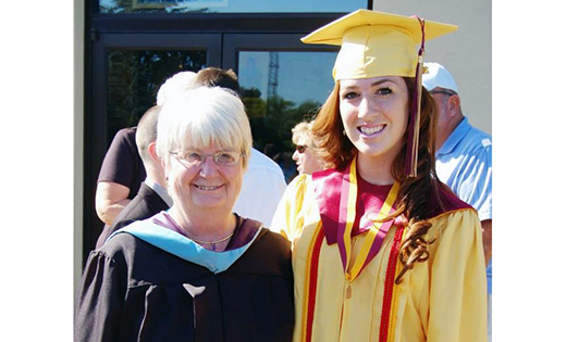 Siobhan McGirl poses for a graduation photo with Superintendent of Catholic Schools Mary Boyle.