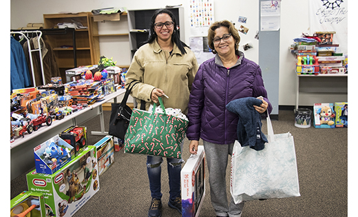 Catholic Charities welcomed evacuees from Puerto Rico, many of whom lost their homes to Hurricane Maria and fled the island with only what they could fit in a suitcase, to join a toy drive on Dec. 18 where they could pick out donated Christmas gifts for their children.

Photo by Mary McCusker