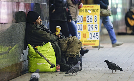 A homeless Ukrainian man collects money in downtown Kiev.

CNS photo/Sergey Dolzhenko, EPA