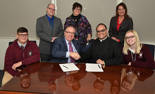 Saint Joseph High School, Hammonton, expands its Pathway to College initiative by signing a partnership-agreement that will enable the two institutions to collaborate in academic and college preparation opportunities. The partnership includes guaranteed admissions for qualified SJHS students, Partnership Scholarships exclusive for qualifying SJHS students with a maximum award of $64,000, dual-credit courses, grant funding opportunities, peer mentoring, and internships. Pictured from left are Dillon Kramer (SJHS Class of 2018), Edward P. Wright (director of undergraduate admissions), Dr. Chris Domes (president, Neumann University), Susan P. Kassab (dean of enrollment management), Father Allain B. Caparas (principal and president, Saint Joseph High School), Louise Fourney (director of guidance, SJHS) and Carina Barse (SJHS Class of 2018).