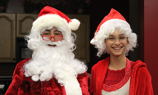 Daniel Dever and Kaitlyn Canal help with the celebration of Saint Nicholas Day Dec. 6 at Christ the King School, Haddonfield.