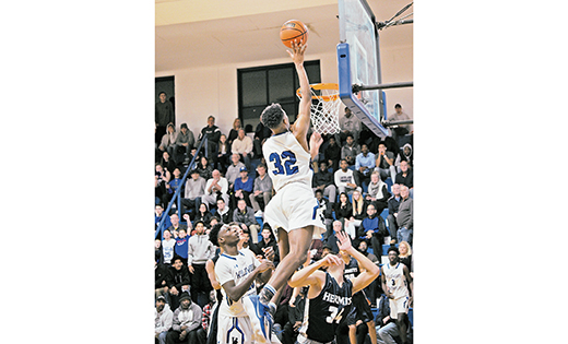 Taj Thweatt of Wildwood Catholic goes up to the basket during his team’s fiercely-fought 65-61 home win over Saint Augustine on Jan. 15. At 6-foot-6, the sophomore center scored 16 points, grabbed seven rebounds and blocked four shots.

Photo by Alan M. Dumoff