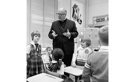Bishop George H. Guilfoyle with Catholic school children.