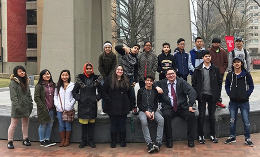 Patrick Barry, director of Refugee Resettlement of Catholic Charities, Diocese of Camden, poses for a photo with a group of refugee teenagers on the Temple campus. The group was given a tour of the Philadelphia university on Feb. 10. “It’s important for these young teens to think about opportunities that they may have not ever considered until now,” said Barry.

Photo by Priscilla Adams