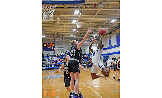 In a double overtime thriller, the high school girls’ basketball team at Paul VI squeaked by visiting Bishop Eustace (Pennsauken) 71-69 on Feb. 28 in Haddonfield. Above, Paul VI’s Naomi Shorts tries to get a shot over Bishop Eustace’s Megan McLaughlin.
Photo by Alan M. Dumoff
