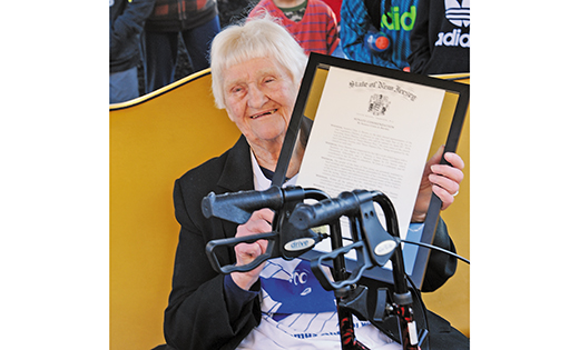 Sister Shamus Zehrer, RSM holds the state plaque designating the naming of “Sister Shamus Way,” on the cross-street of Our Lady Star of the Sea Regional School, on April 28 in Atlantic City during the ninth annual walk that bears her name. After a 46-year teaching career, 38 of them spent as principal of Our Lady Star of the Sea, Sister Shamus retired in 2014.