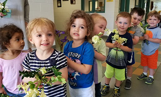 The youngest students at Bishop McHugh Regional School, Cape May Court House, line up with flowers to take part in the school’s recent May Procession.