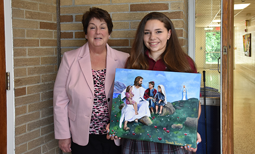 — Daniela Turchi, a member of the graduating class, dedicated her acrylic painting “Blessed are the Children” to Saint John Paul II Regional School, Stratford. It is displayed in the school’s main entrance. “We feel grateful and blessed that Daniela shared her artistic talents with the school and leaves behind a beautiful reminder of how much Jesus loves the children,” said Helen Persing, principal, pictured at left.

Photo by James A. McBride