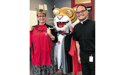 Father Allain Caparas, president of Saint Joseph High School, Hammonton, welcomes Deborah Jewell, who joined the school last month as Director of Advancement.