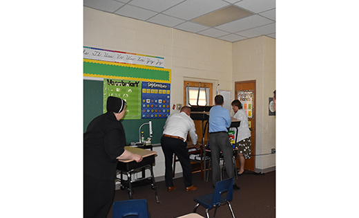 Photo by James A. McBride

As part of violent intruder training, South Jersey Catholic School administrators use desks and other classroom objects to build a barricade. The workshop was held at Holy Angels School in Woodbury on Aug. 21.