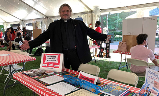 Father Krzysztof Wtorek, Campus Catholic Minister and chaplain, welcomes students at Rutgers-Camden University, on Aug. 30.