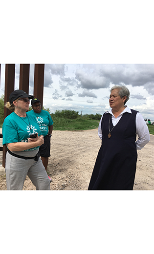Sister Norma Pimentel, executive director of Catholic Charities of the Rio Grande Valley, talks to Share the Journey volunteers about the needs of families entering the United States after enduring a long journey and processing at facilities.