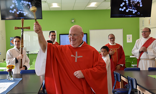 Father Robert E. Hughes, Vicar General of the Diocese of Camden, blesses the Buono Family STREAM lab at Saint Mary School, East Vineland, on Sept. 21.

Photo by James A. McBride