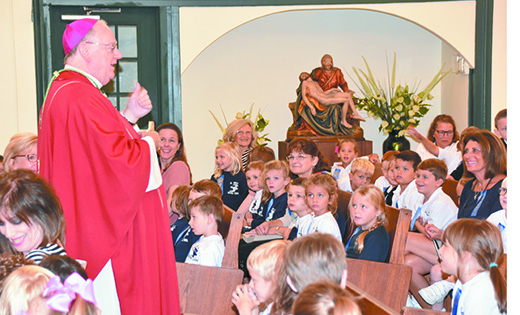 Bishop Dennis Sullivan, above, speaks to students of Saint Joseph School. Somers Point, during Mass Sept. 14 to commemorate the school’s 60th anniversary. Concelebrating were Father Michael M. Romano, Father Anthony Manuppella, Father John J. Vignone, Father Paul D. Harte, Father Josef A. Wagenhoffer, Father Joshua Nevitt and Father Jaromir Michalak, pastor of Saint Joseph Parish.