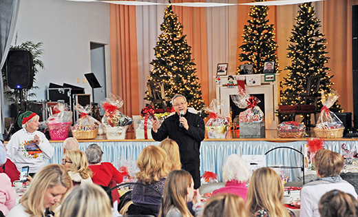 Father Joseph An Nguyen, pastor of Most Precious Blood Parish, Collingswood, speaks to parishioners at the parish Christmas Tea Luncheon on Dec. 9.

Photo by Alan M. Dumoff