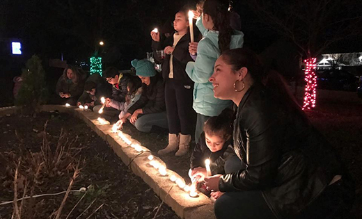 Marianela Nuñez, field consultant for Latino enrollment in South Jersey Catholic Schools, joins in a night of candles celebration for the feast of the Immaculate Conception.