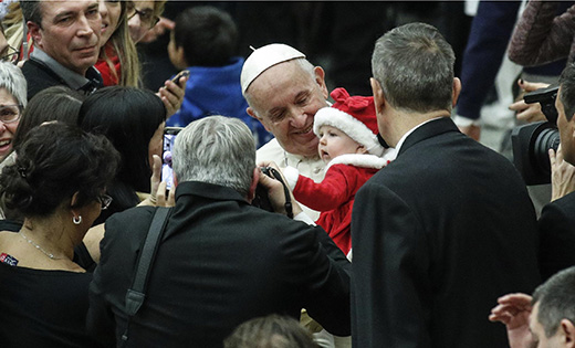 Pope Francis holds a baby on the eve of his 82nd birthday during a Dec. 16 audience with children and families from the Santa Marta Dispensary, a Vatican charity that offers special help to mothers and children in need, at the Vatican.


(CNS photo/Giuseppe Lami, EPA)