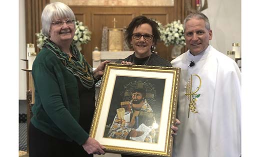 Patricia Mancuso, principal of Saint Mary School, Williamstown, accepts an image by Brother Mickey McGrath from Mary Boyle, superintendent of schools for the Diocese of Camden, and Father Cadmus D, Mazzarella, pastor of Saint Mary Parish.


Photo by Mary Beth Peabody