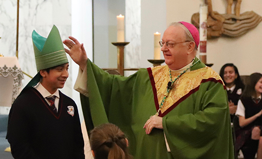 Bishop Dennis Sullivan celebrated Mass to conclude Catholic Schools Week with the students, faculty, and staff at Bishop Schad Regional School in Vineland on Feb. 1. Emiliano Garcia-Roja, an eighth grader, mentioned that his favorite day of Catholic Schools Week was Crazy Hat Day. Bishop Sullivan let him try on the miter — his own “crazy” hat.



Photo by Mike Walsh