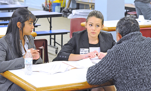 Noreen Ahmed and Nina Rodriguez, both students from Rutgers University Law School, volunteer at a workshop to help immigrants designate a Power of Attorney who will be able to make decisions for the care of their children in case a family is separated through the arrest or deportation of a parent. It was held at Saint Joseph Pro-Cathedral, Camden, on Feb. 3.


Photo by Alan M. Dumoff