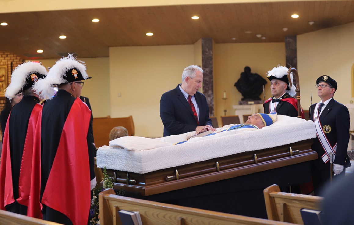 Kevin Hickey, executive director of Catholic Charities, Diocese of Camden, pays his respects during the viewing at Saint Agnes Church, Our Lady of Hope Parish, Blackwood.     ----- Photo by Mike Walsh