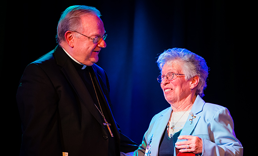 Bishop Sullivan congratulates Helen Fowler of Church of the Incarnation, Mantua.