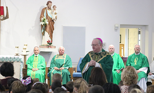 Bishop Dennis Sullivan addresses students during Mass in celebration of the 70th anniversary of their school, Saint Mary in Williamstown, on Oct. 3. Pictured in back are, from left, are Father Cadmus D. Mazzarella, pastor of Our Lady of Peace Parish; Deacon John Kacy; Father Robert Hughes, Vicar General; and Father Christopher T. Bakey, parochial vicar.