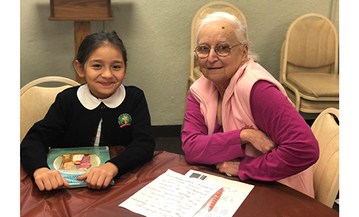 A third grade student of Our Lady of Mount Carmel School, Berlin, and her pen pal pose for a photo.