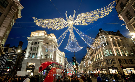 Christmas shoppers make their way under an illuminated angel along Regent Street in London. 

(CNS photo/Lisi Niesner, Reuters)