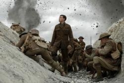 George MacKay, center, stars in a scene from the movie "1917." The Catholic News Service classification is A-III -- adults. The Motion Picture Association rating is R -- restricted. Under 17 requires accompanying parent or adult guardian. (CNS photo/Universal) See MOVIE-REVIEW-1917 Jan. 9, 2020.