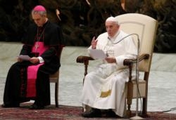 Pope Francis speaks during his general audience in Paul VI hall at the Vatican Jan. 15, 2020. Also pictured is Archbishop Georg Ganswein, prefect of the papal household. (CNS photo/Paul Haring) See POPE-AUDIENCE-WORD Jan. 15, 2020.