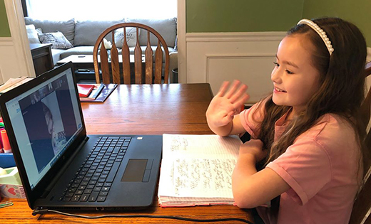 It’s “Free Read Friday” for third graders at Saint John Paul II Regional School in Stratford. Mia Waldby and her classmates meet on Zoom to share stories they have written throughout the week.