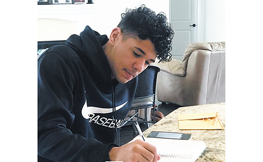 Sabien Rivera, a junior at Saint Joseph High School, Hammonton, prepares for his online Algebra class. Rivera is a member of Saint Joe’s baseball team.