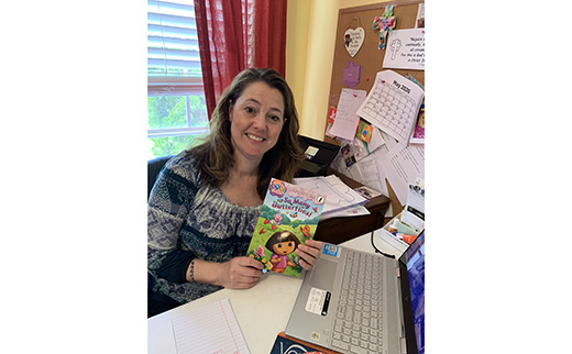 Like any other working parents, Christina Figurelli, a teacher at Saint Michael the Archangel Regional School in Clayton, is working everyday and also keeping up with her own children's education. "We each have our own workspace and we break for lunch together," she said.