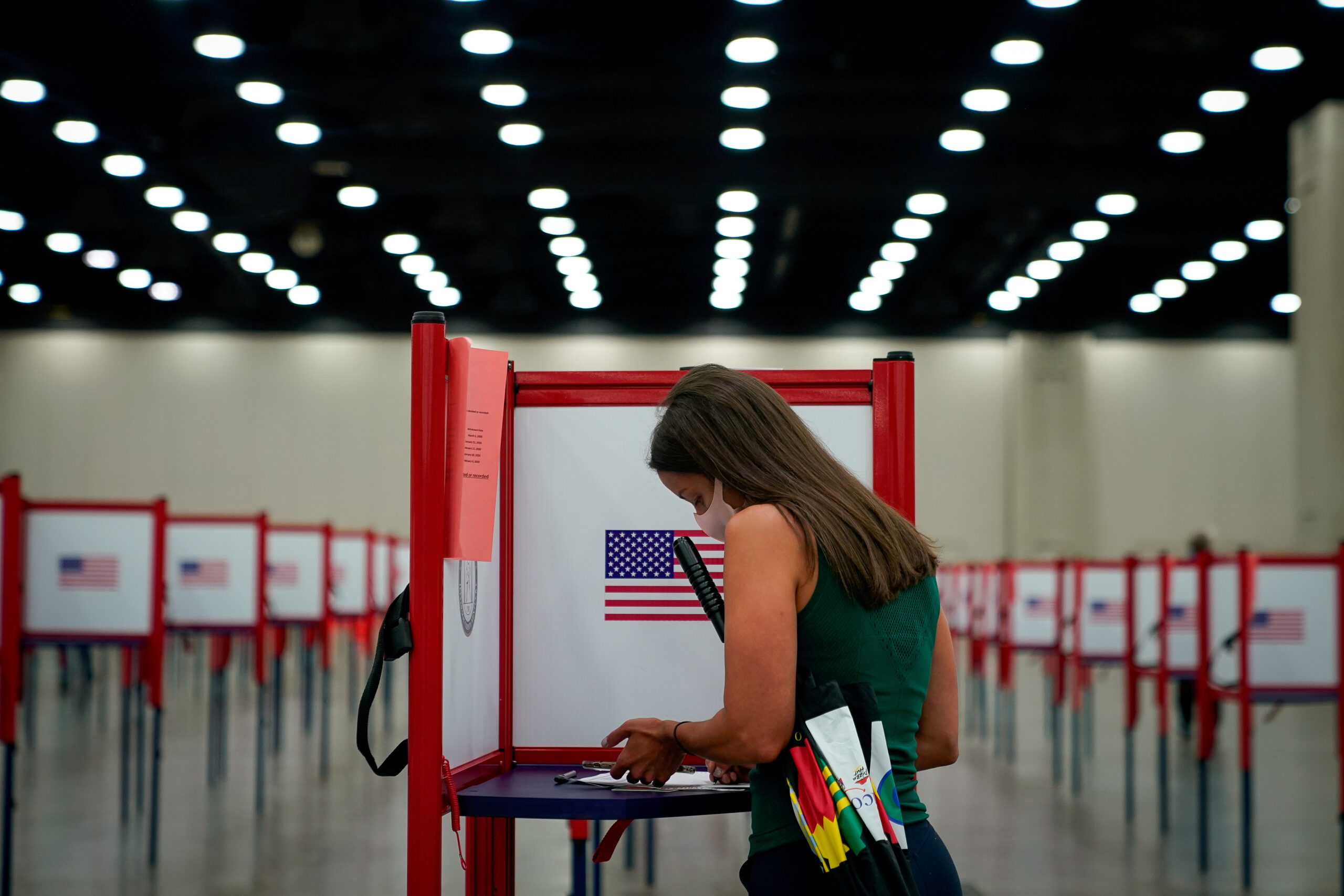 A woman in Louisville, Ky., votes during the primary election June 23, 2020, during the coronavirus pandemic. (CNS photo/Bryan Woolston, Reuters) See ELECTION-2020-RACISM-RELIGION-COVID July 13, 2020.