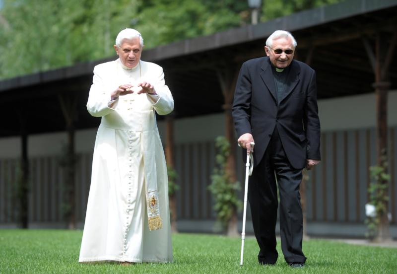 Retired Pope Benedict XVI is seen in a file photo strolling in a garden in Bressanone, Italy, with his brother, Msgr. Georg Ratzinger. Msgr. Ratzinger, 96, died July 1, 2020. (CNS photo/L'Osservatore Romano via Reuters) See OBIT-GEORG-RATZINGER July 1, 2020.