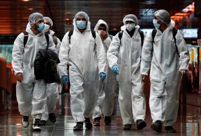Seafarers who had spent months working aboard vessels during the COVID-19 pandemic arrive June 12, 2020, at Changi Airport in Singapore. (CNS photo/Edgar Su, Reuters)