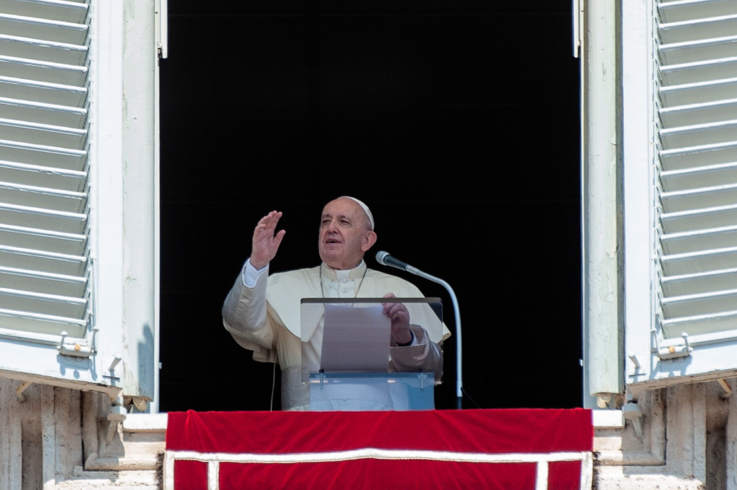 Pope Francis offers a blessing from a window overlooking St. Peter's Square at the Vatican during his Aug. 15, 2020, Angelus on the feast of the Assumption of Mary. (CNS photo/IPA/Sipa via Reuters)