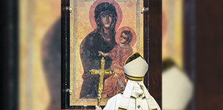 Pope Francis prays in front of the Marian icon, "Salus Populi Romani" (health of the Roman people), during Easter Mass in St. Peter's Basilica at the Vatican April 12, 2020. The Mass was celebrated without the presence of the public due to the coronavirus pandemic. (CNS photo/Andreas Solaro, Reuters pool) See POPE-EASTER-SUNDAY April 12, 2020.
