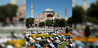 Muslims attend Friday prayers outside Hagia Sophia Grand Mosque in Istanbul July 24, 2020. Hagia Sophia was built as an Orthodox Christian cathedral and stood as the seat of Eastern Christianity for a thousand years before Ottoman Turks conquered its host city and turned it into a mosque in 1453. In 1934, it was designated as a museum revered as a symbol of Christian and Muslim unity until being transformed into a mosque this July. (CNS photo/Umit Bektas, Reuters)