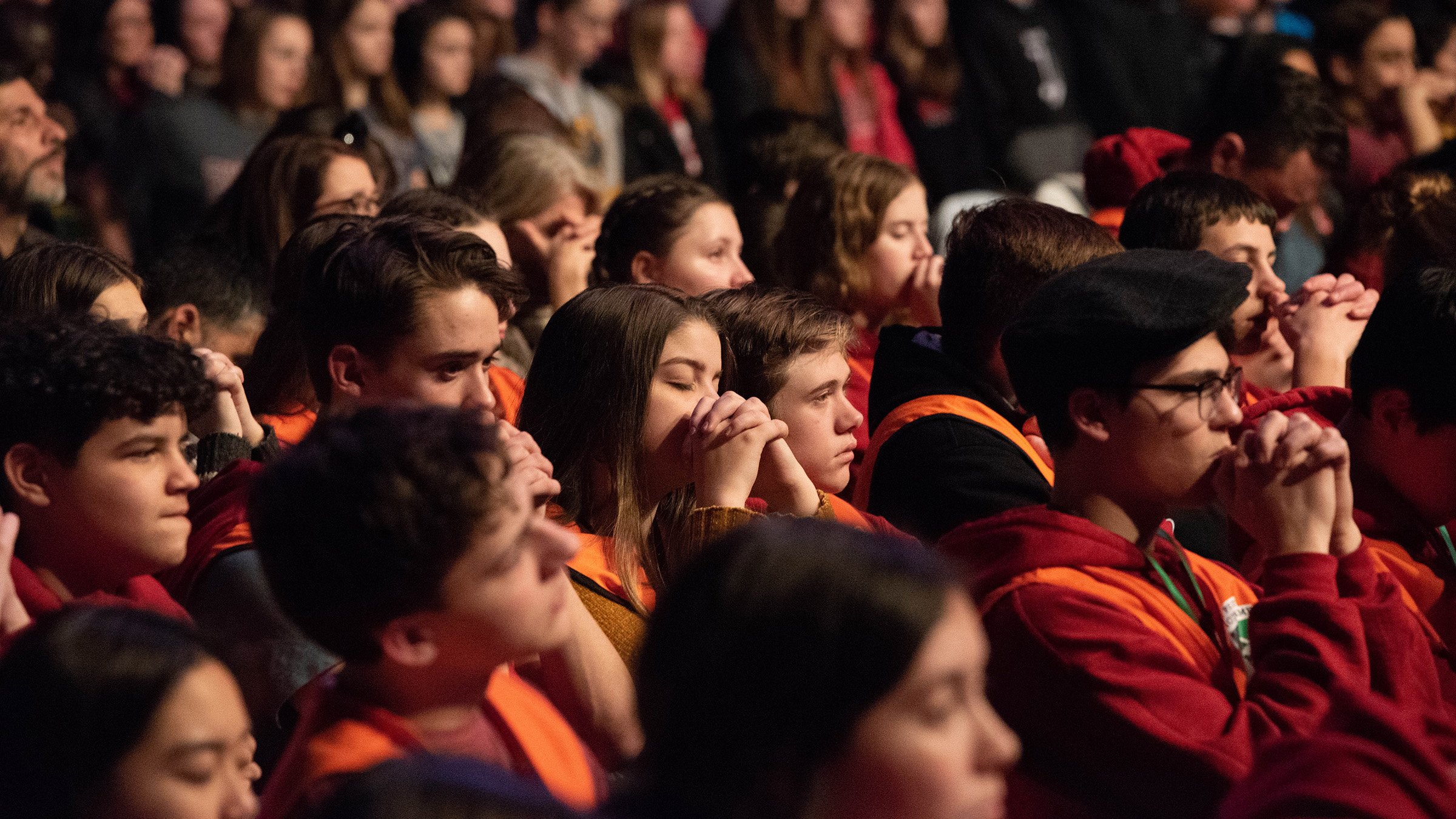 Teens pray during adoration at a "Life is VERY Good" event at EagleBank Arena in Fairfax, Va., Jan. 23, 2020. A Pew Research Center study released in September shows that teens' religious practice is less than that of their parents. (CNS photo/Zoey Maraist, Arlington Catholic Herald)