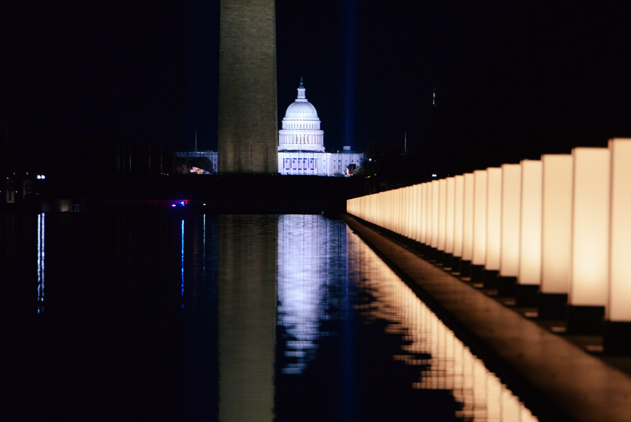 The U.S. Capitol is seen reflected at the reflecting pool at the Lincoln Memorial in Washington Jan. 19, 2021, after President-elect Joe Biden hosted a memorial honoring those who died from the coronavirus disease. (CNS photo/Callaghan O'Hare, Reuters)