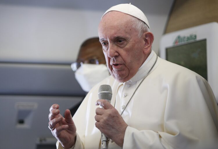 Pope Francis speaks with journalists aboard his flight from Baghdad to Rome March 8, 2021. (CNS photo/Paul Haring)