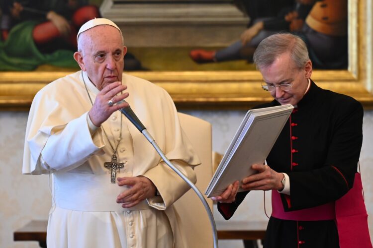 Pope Francis gives his blessing during his general audience in the library of the Apostolic Palace at the Vatican April 14, 2021. (CNS photo/Vatican Media)