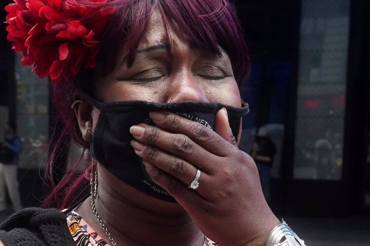 A woman in New York City reacts April 20, 2021, after former Minneapolis police officer Derek Chauvin was found guilty of second-degree unintentional murder, third-degree murder and second-degree manslaughter in the death of George Floyd. (CNS photo/Carlo Allegri, Reuters)